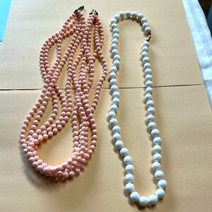 Set of beaded antique necklaces 1 pink multi strand and 1 white single strand